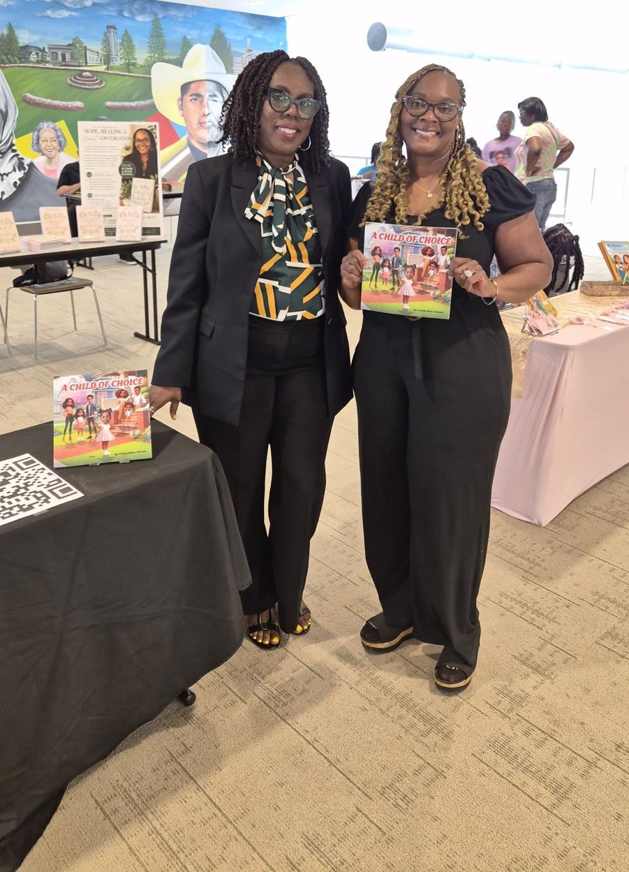 Reader smiling with A Child of Choice at a book signing